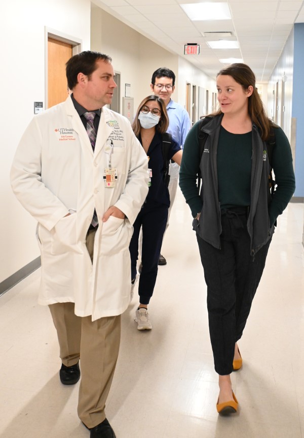 Residents walk alongside their attending