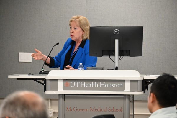 Woman at podium, presenting