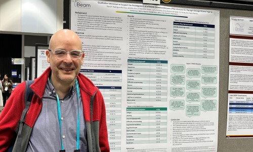 Man standing in front of research poster