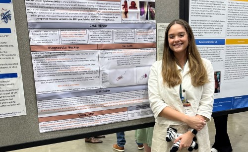 Woman standing in front of research poster
