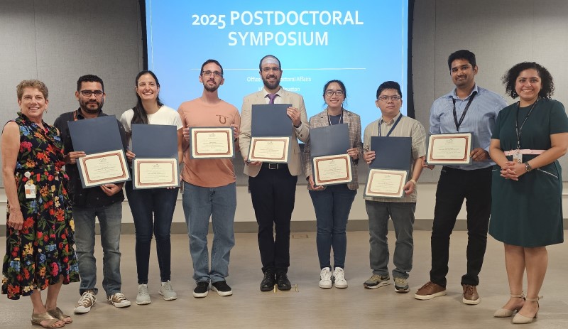 Group of presenters with certificates