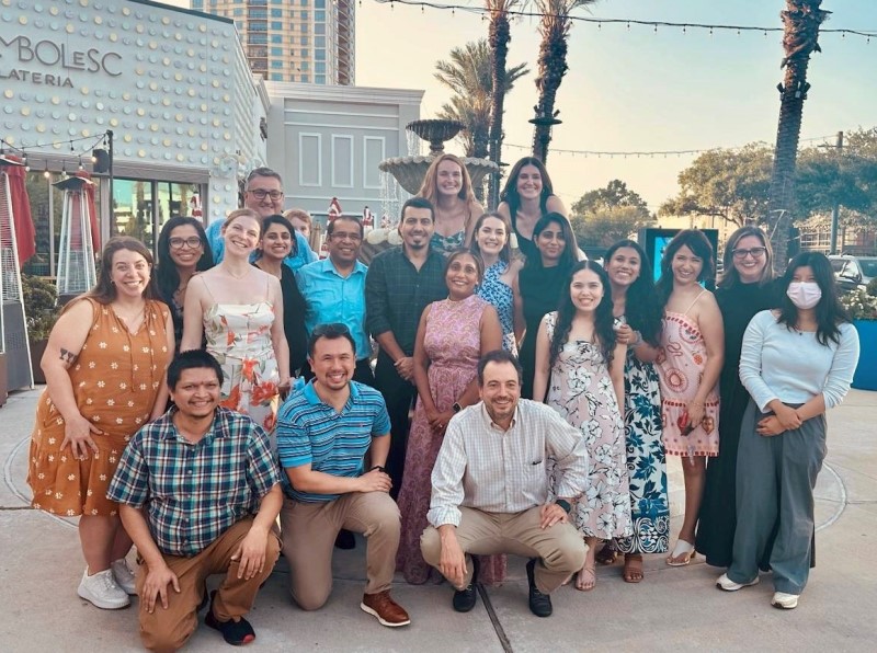 Group of people outside in front of restaurant