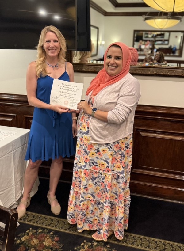 Doctor receiving certificate