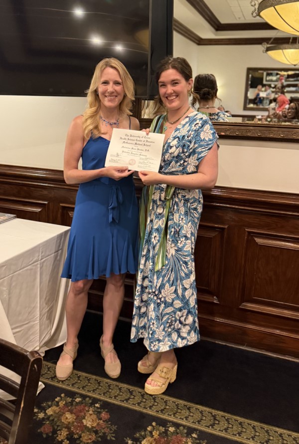 Doctor receiving certificate