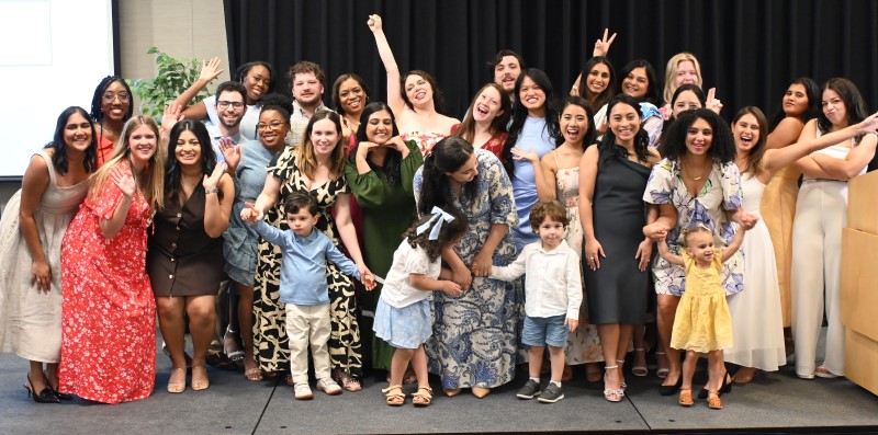 Group of people doing silly poses on platform
