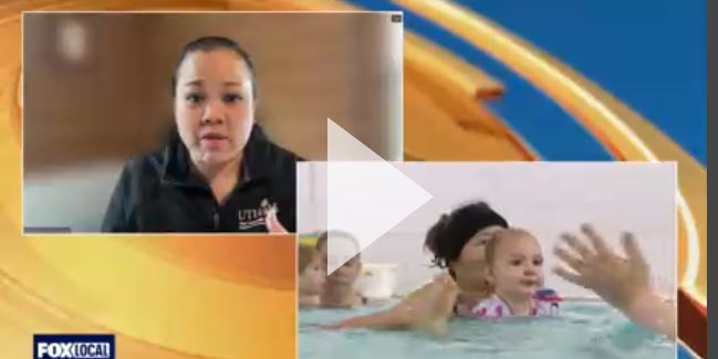 Screenshot of Dr. Kwan speaking with video of baby swimming