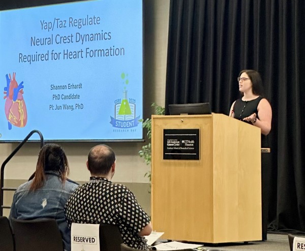 Woman presenting at podium