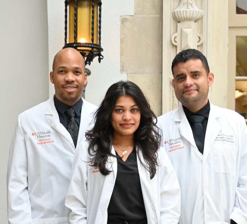 3 doctors in white coats in atrium