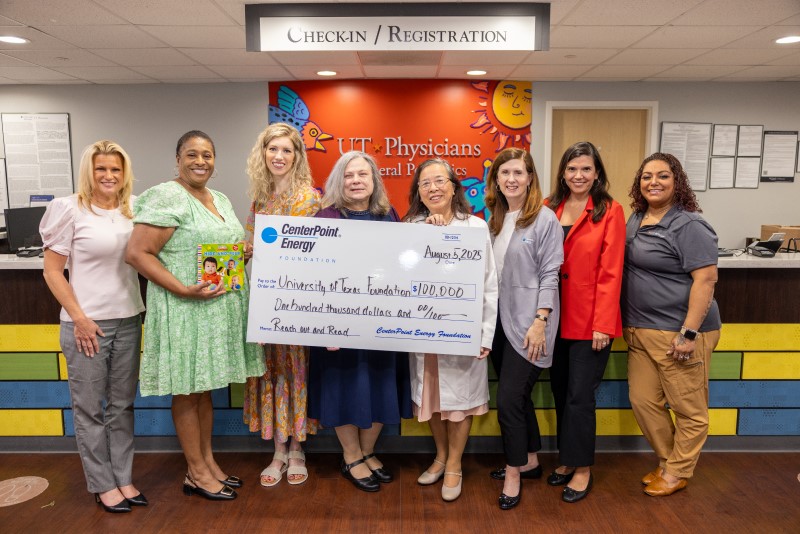 Group of women holding oversized check