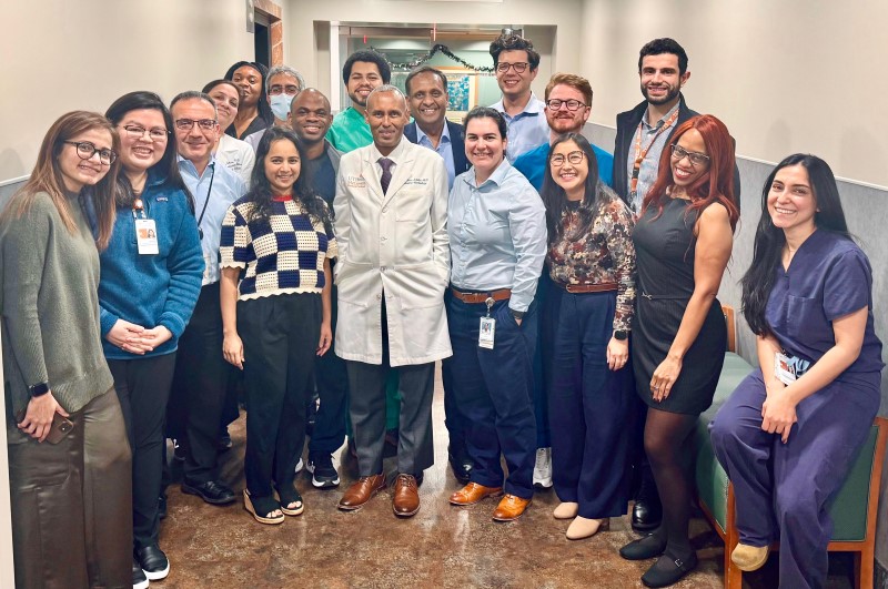 Group of doctors posing together in hallway