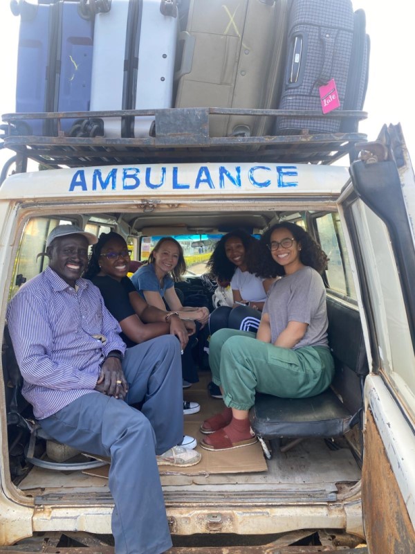 Five people in the back of a bush taxi