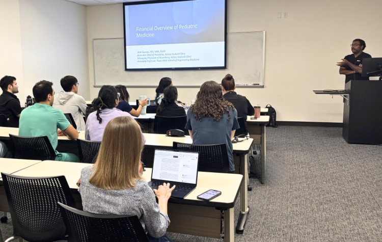 Doctor presenting to residents