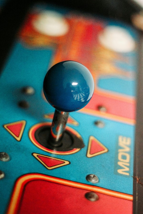 Close-up of a joystick on an arcade game