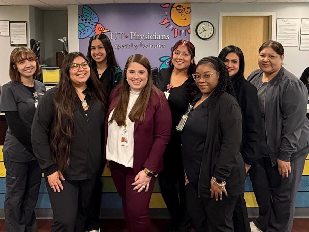Group of women standing in front of clinic welcome desk