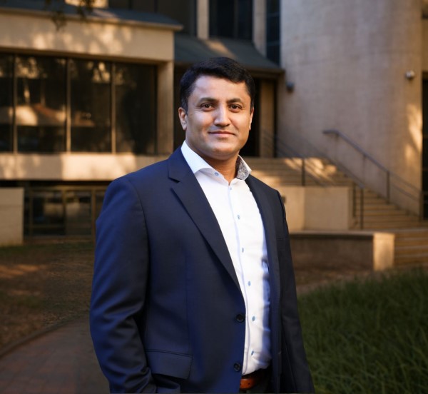 Man standing in outdoor courtyard