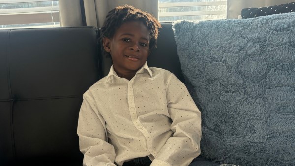 Little boy sitting on couch