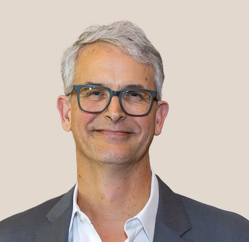 Man with glasses smiling