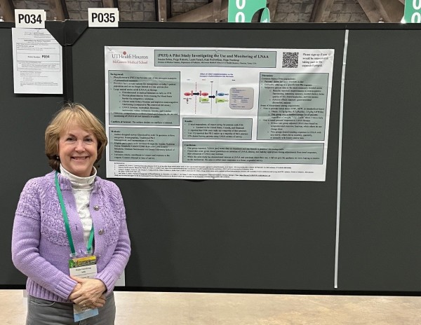 Dr. Northrup standing in front of research poster