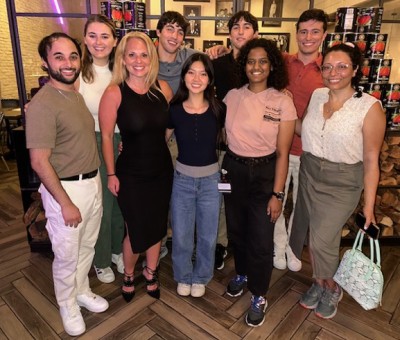 Group of people standing together in restaurant