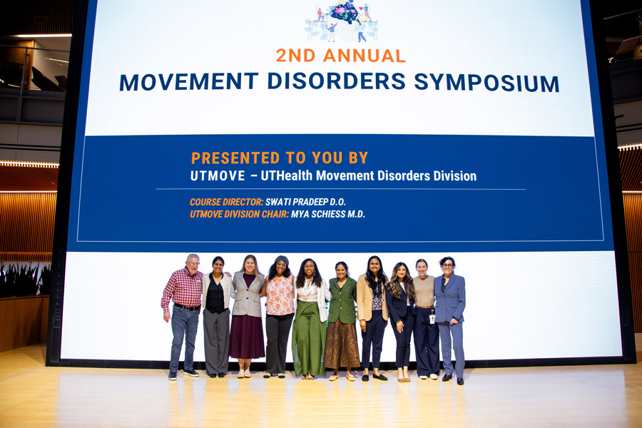 Group of doctors in front of huge screen