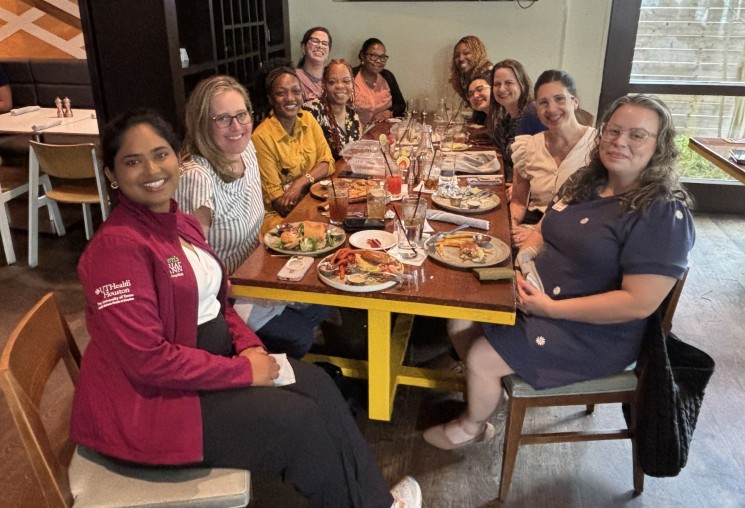 Group of women seated around the table at a restaurant