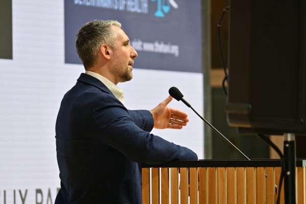 Dr. Testa speaking at podium