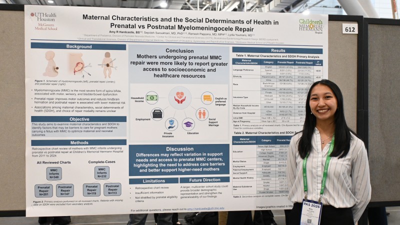 Amy Hardcastle stands in front of research poster