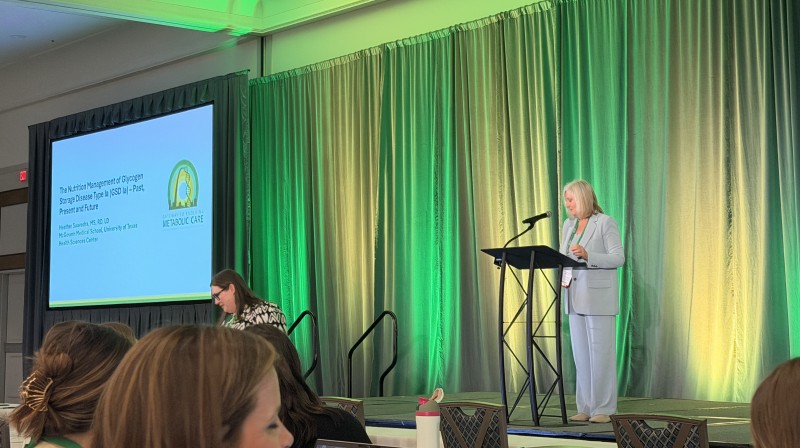 Heather Saavedra presents at podium