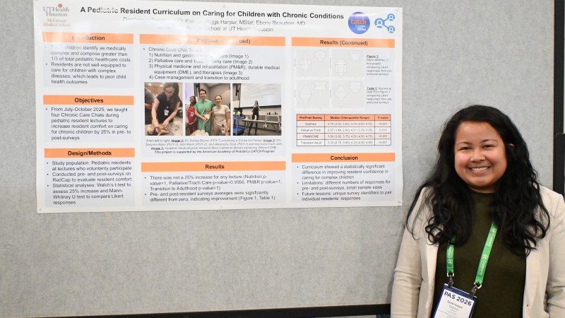 Dr. Dagdag stands in front of research poster