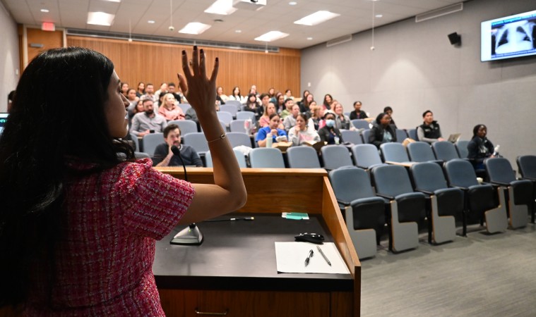 Teacher at podium instructing trainees