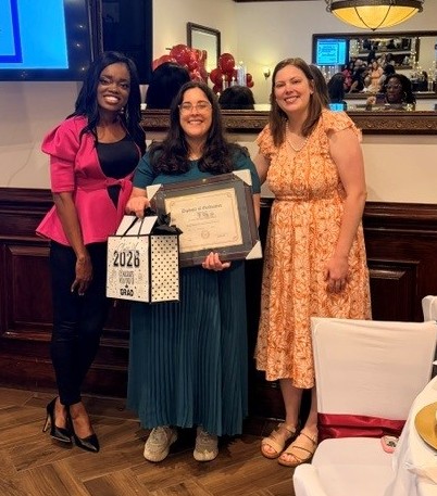Dr. Moody and Dr. Wilson stand with graduating resident