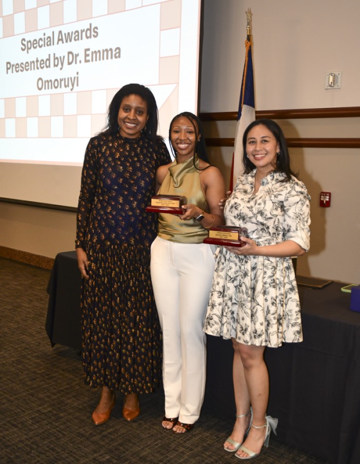 Dr. Omoruyi presents awards to Dr. Laws and Dr. Balbas
