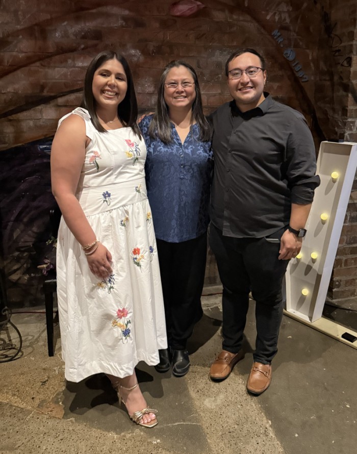 Graduating fellows with program director