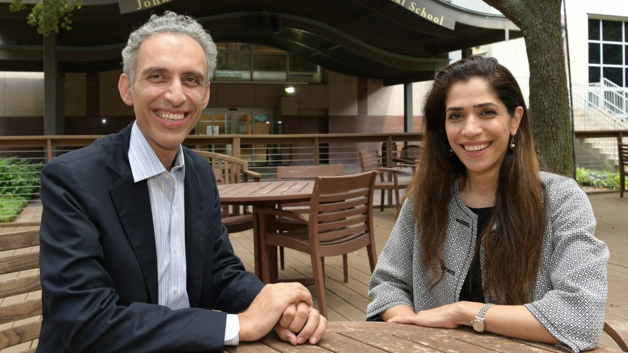 Dr. Bishehsari and Dr. Mahdavinia sit at table together in Webber Plaza