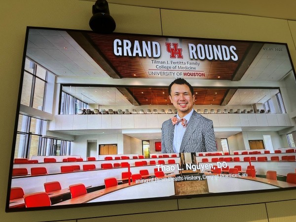 Dr. Nguyen on screen during Grand Rounds