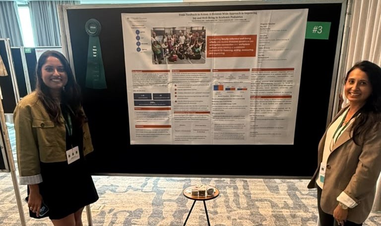 Dr. Mahadevan and team mate at research poster