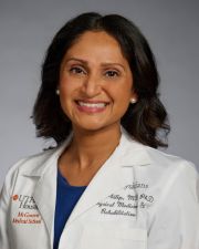 Professional Photo of Kemly Philip in a white coat