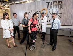 Picture of a therapy session for a woman needed crutches and leg braces to walk