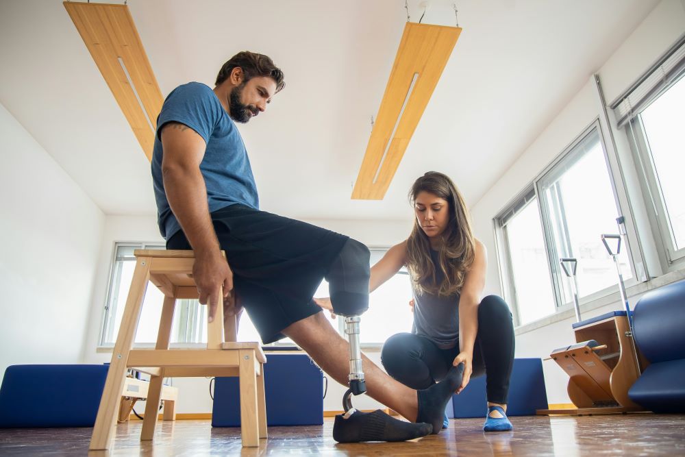 Picture of a therapy session for a man who has a prosthetic leg
