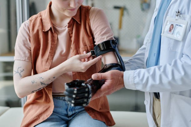 Person being fitting for a robotic arm