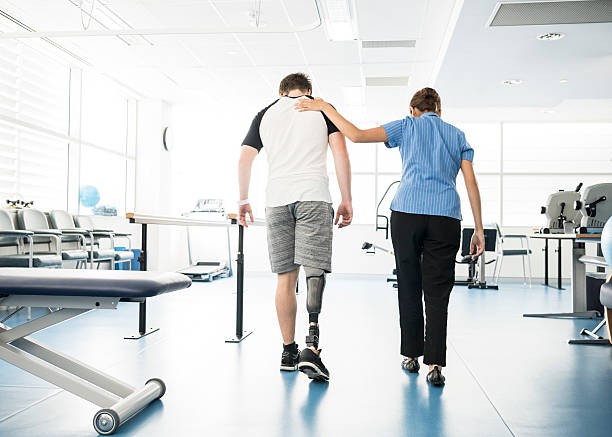 Person learning how to walk with a prosthetic leg