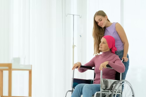 Cancer patient being pushed around by a younger girl