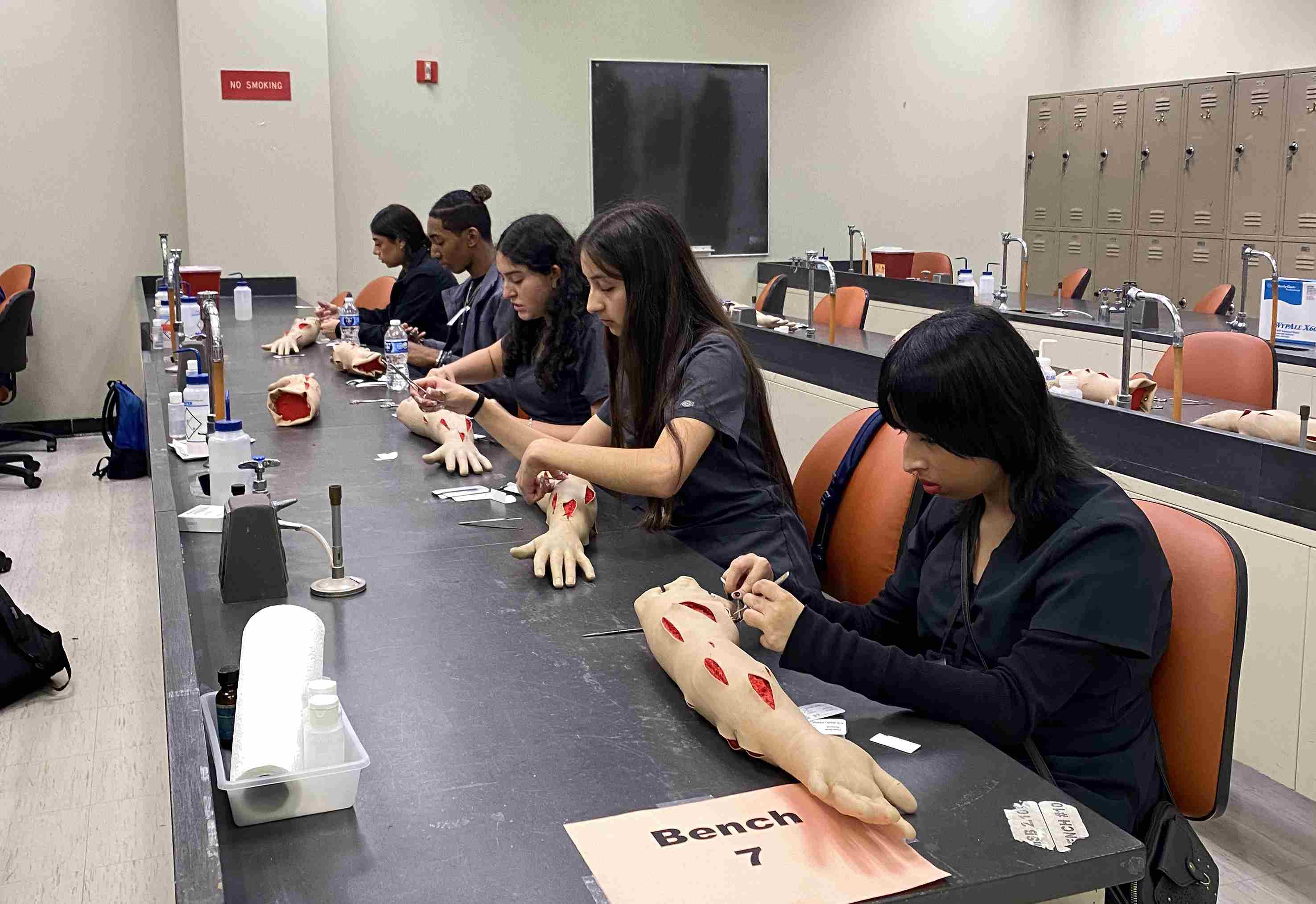 students of Emerging Health Professions Program doing suturing