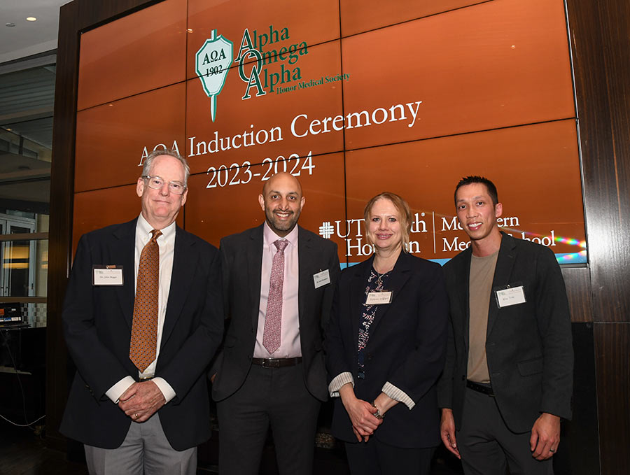 Group photo at the Alpha Omega Alpha Honor Medical Society event to welcome McGovern inductees for 2024 with Dr. John Riggs