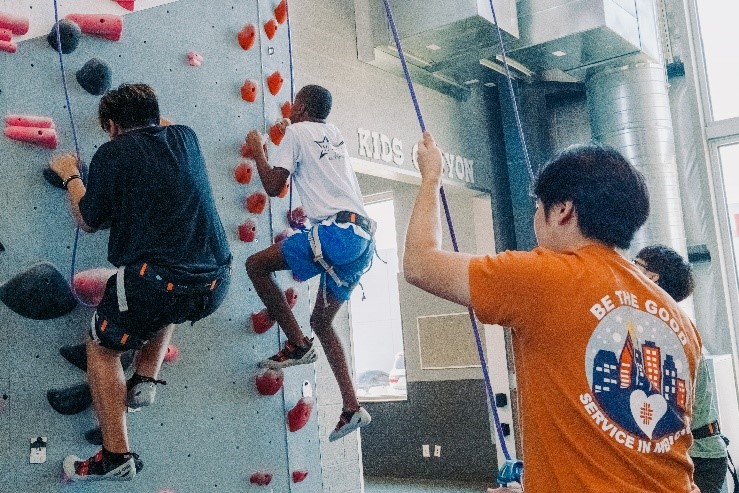 Climbing Club students and kids climbing wall at Katy's Indoor Climbing.