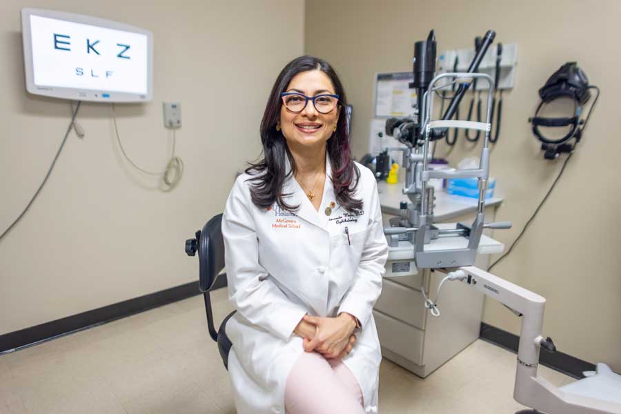Dr. Gioconda Mojica sitting inside clinical room.