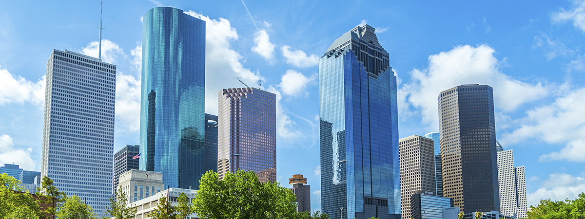 Skyline of Houston, Texas in daytime under blue sky-horizontal