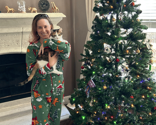 Kacy Smith by tree with cat for christmas
