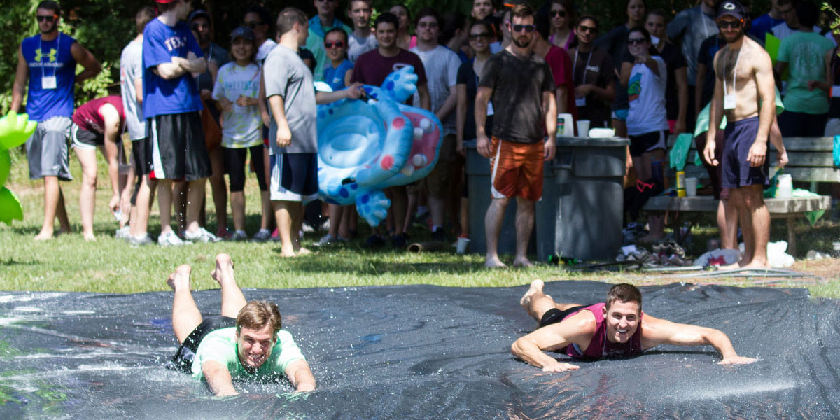 two people on a slip and slide