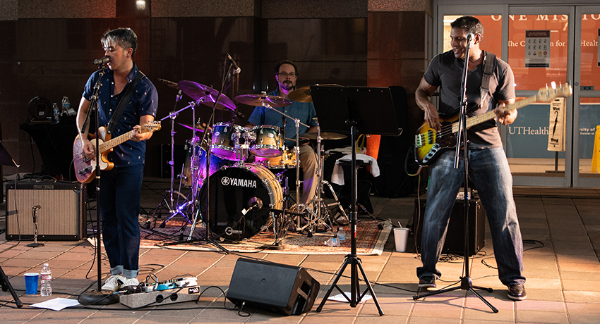 Phuong Nguyen, MD, Mark Dannenbaum, MD, and Soham Roy, MD, performing in support of Cleft & Craniofacial Awareness Month. (Physicians listed from left to right) (Photo by Kim Kham, UT Physicians)